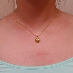 Solid 18k  yellow gold with heart pendant.